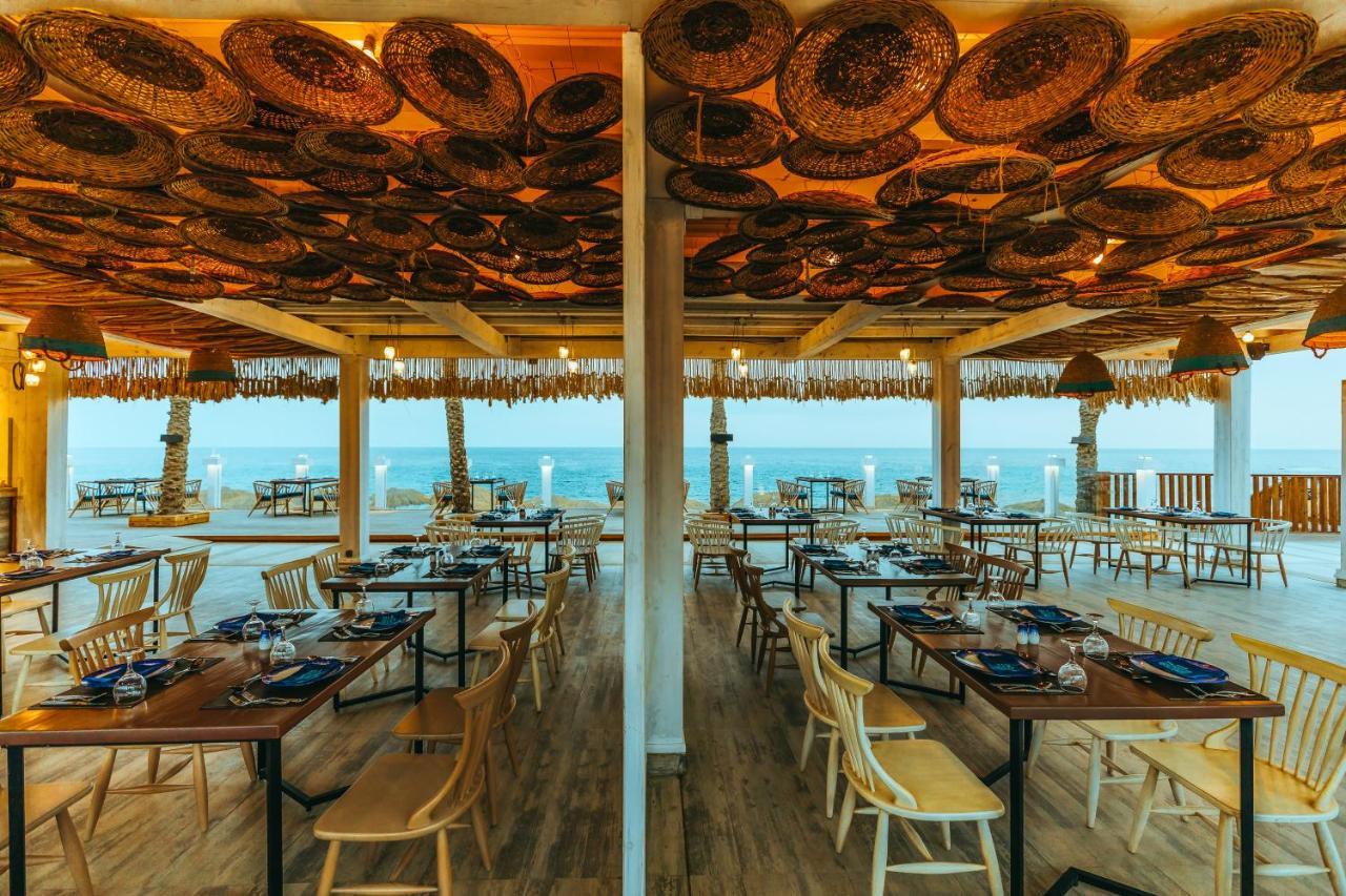Sunrise Diamond Beach Resort -Grand Select Sharm el Sheikh Esterno foto The restaurant at the top of the lighthouse